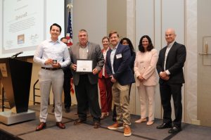 Spincraft accepting a Certificate of Innovation from Raytheon